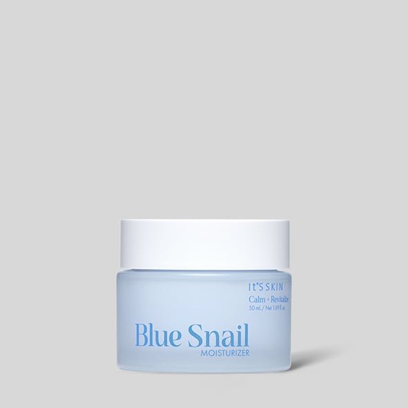 Light blue jar of hydrating Blue Snail moisturizer with a white lid on plain gray background