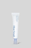 White squeeze tube labeled Blue Snail for hydration and soothing skin treatment on light gray background