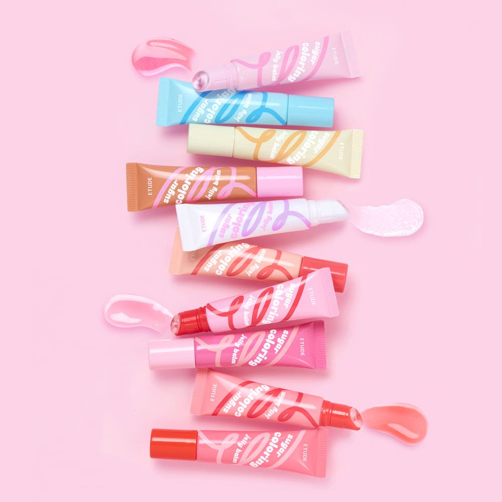 ETUDE Sugar Coloring Jelly Balm 9g tubes in various shades with hydration boost swatches on pink background