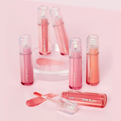 ETUDE Overglowy Gloss #Sarr Sweeties 3g in assorted peach and pink shades with volumizing effect on soft pink background