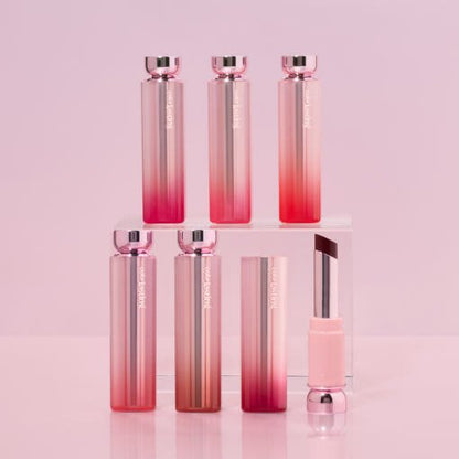 ETUDE Color Lasting Glow Stick 3.2g with sleek ombre pink packaging and hydration boost formula displayed on acrylic blocks