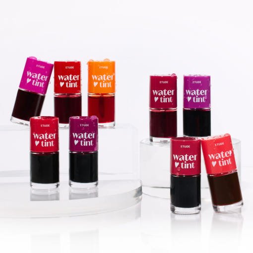 ETUDE Dear Darling Water Tint 9g in vibrant shades arranged on clear platforms showcasing color variety and brightness
