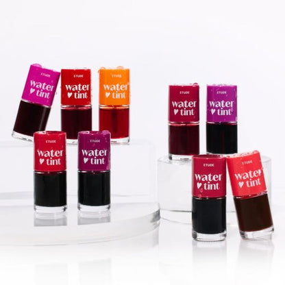 ETUDE Dear Darling Water Tint 9g in vibrant shades arranged on clear platforms showcasing color variety and brightness