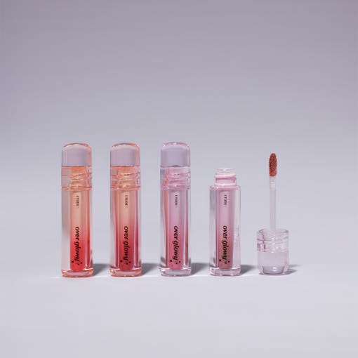 ETUDE Over Glowy Tint 3g #Not Bad in varying pink and peach shades with glossy finish lip tint tubes arranged in a row