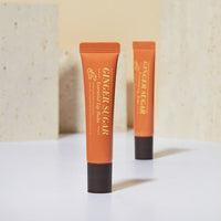 ETUDE Ginger Sugar Essential Lip Balm 15ml in orange tube with black cap offering long-lasting hydration