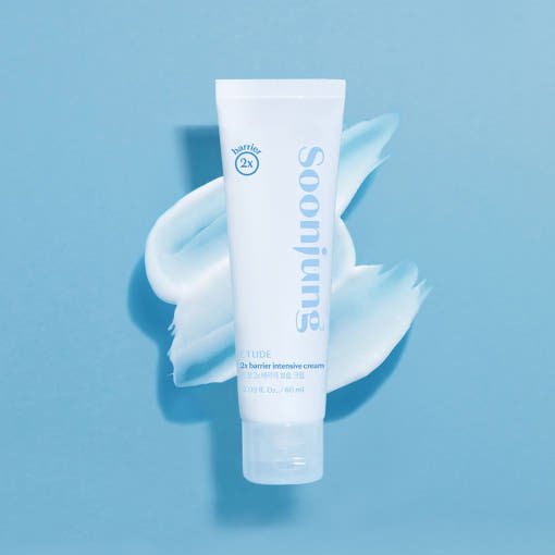ETUDE Soonjung 2x Barrier Intensive Cream 60ml in white tube on blue cream texture background for deep hydration