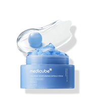 medicube Hyaluronic Moisturizing Capsule Cream 55g in blue jar with deep hydration capsules and clear gel smear