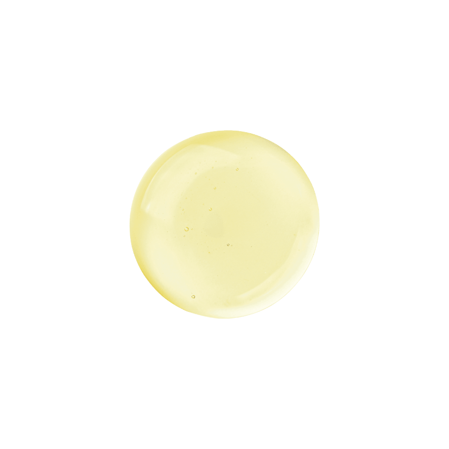 Clear pale yellow serum droplet with smooth texture and tiny air bubbles on transparent background