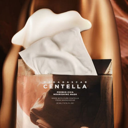 Open packet of nourishing sheet mask with creamy texture on brown satin background highlighting elasticity benefits