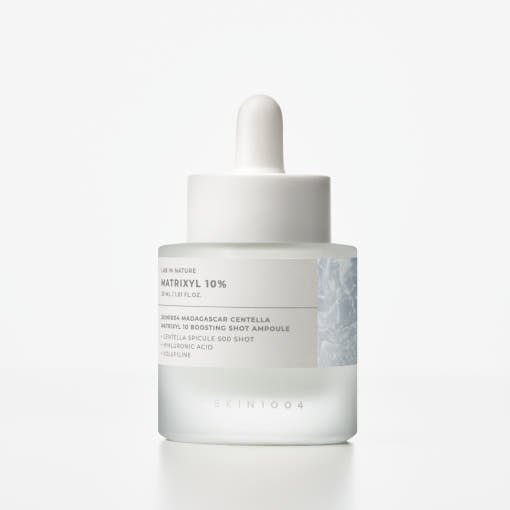 Frosted glass dropper bottle with white cap containing hydrating boost serum on plain white background