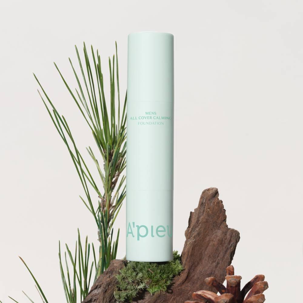 A'pieu Men's All Cover Calming Foundation 12g (2 Colors) in sleek mint green packaging with natural wood and pine accents