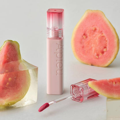 A'pieu Juicy Pang Jelly Tint 3.5g with hydrating formula next to fresh guava slices and clear gel cubes