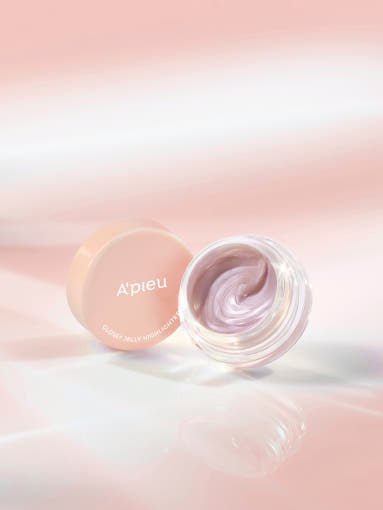 A'pieu Juicy Pang Glossy Jelly Highlighter 3.8g (2 Colors) in jar showing luminous glow with soft pink swirled texture