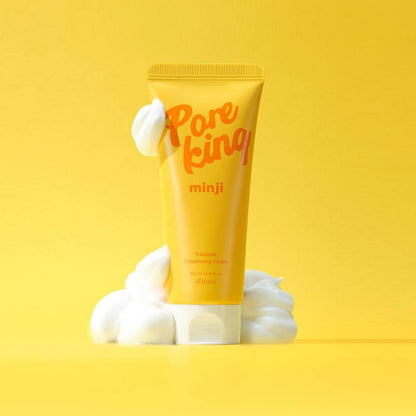 A'pieu Pore King Minji Trouble Cleansing Foam 200ml with creamy foam on bright yellow background for thorough cleansing