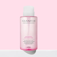 A'pieu Aqua Nature Rose Dew Drop Brightening Toner 500ml bottle with light pink liquid on soft pink background