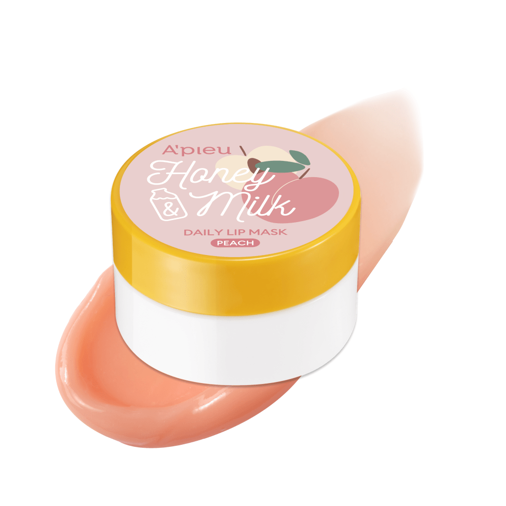 A'pieu Honey & Milk Daily Lip Mask 6g (3 Flavours) in white jar with yellow lid and peach-colored lip mask swatch for moisture boost