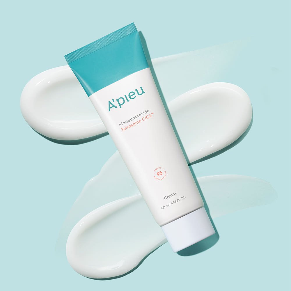 A'pieu Madecassoside Tetrasome CICA Cream 120ml tube with smooth cream swatches on light blue background for intensive moisture