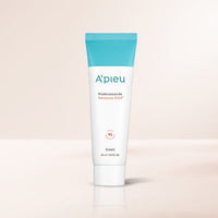 A'pieu Madecassoside Tetrasome CICA Cream 50ml white tube with blue cap offering intensive hydration on light beige background