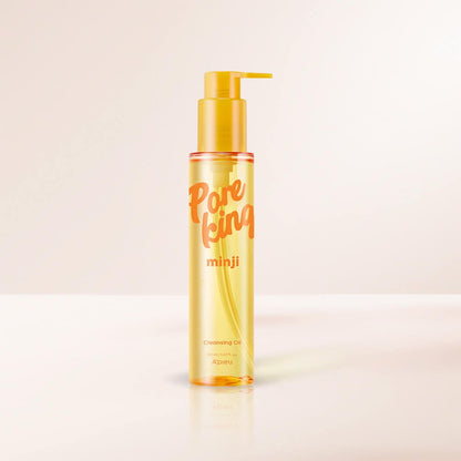 A'pieu Pore King Minji Cleansing Oil 150ml in translucent yellow bottle with pump for gentle cleansing on neutral background
