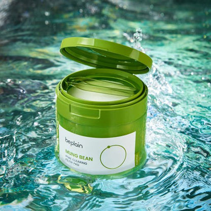beplain Mung Bean Pore Clearing Filter Pad 180ml/70ea in green jar with gentle cleansing on water surface background