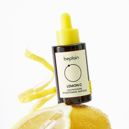 beplain Lemon C Glutathione Brightening Ampoule 30ml with brightening effect and yellow dropper cap on lemon background