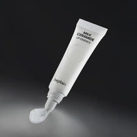 beplain Milk Ceramide Lip Essence 10g in white tube with curved applicator dispensing moisturizing lip treatment for hydration