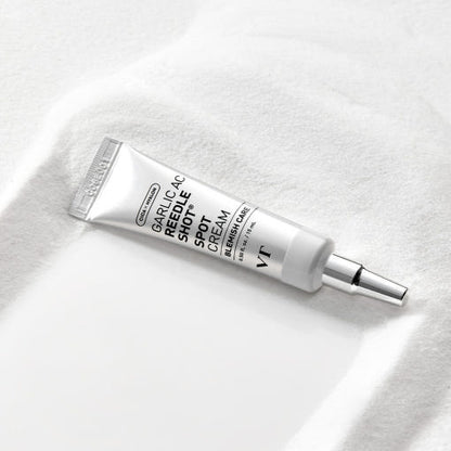 VT Garlic AC Reedle Shot Spot Cream 15ml in white and silver tube for powerful blemish care on light textured surface