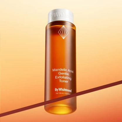 Amber bottle of gentle exfoliating toner with white cap against warm gradient background