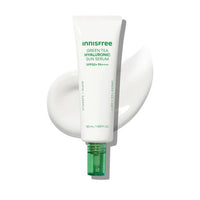 White tube of hydrating sun serum with green pump cap and creamy texture swatch on white background