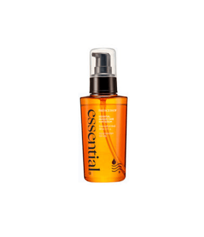 Amber pump bottle of nourishing hair serum with minimal black text and clear plastic cap on white background
