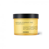 Yellow translucent jar of moisturizing propolis synergy pads with black ribbed lid on white background