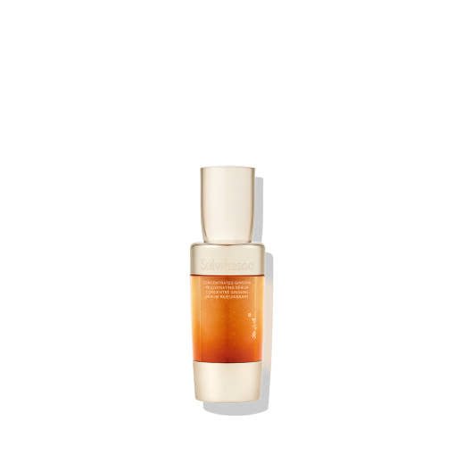 Tall amber gradient serum bottle with beige cap emphasizing fine line reduction benefits on white background