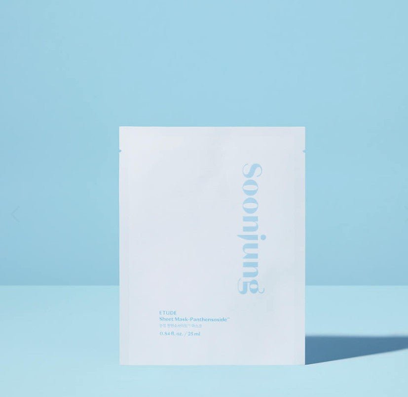 A white rectangular skincare packet with the brand name 'soojung' printed vertically in light blue, set against a solid light blue background.
